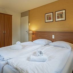 Slaapkamer in Rabbit Hill bungalow 6B met tweepersoonsbed, Veluwe, Gelderland.