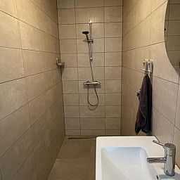 Modern bathroom in Holiday Home in Schildwolde, northeast Groningen, with stylish shower and sink.