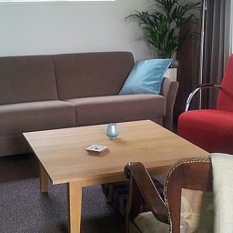 Gemuetliche Sitzecke im Ferienhaus mit Sauna in Vierhuizen, Groningen.