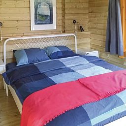 Comfortable bedroom in cottage in Zoutkamp overlooking the nature of Groningen.