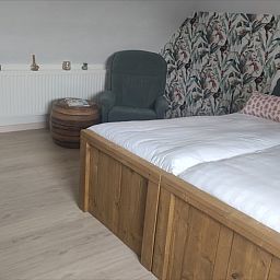 Gemuetliches Schlafzimmer im Ferienhaus in Kelpen-Oler, Mittellimburg, mit bequemen Betten und gemuetlicher Einrichtung fuer einen entspannten Aufenthalt.