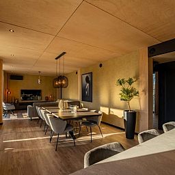 Stylish interior of Bos Villa in Maasbree, North Limburg. Luxury vacation home for 8 with modern furnishings and spacious dining area.