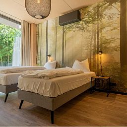 Attraktives Schlafzimmer der Bos Villa DeLuxe XL in Maasbree, Nord-Limburg. Geniessen Sie Ruhe und Natur in diesem Luxus-Ferienhaus fuer 4 Personen.