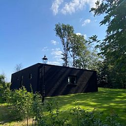 Modern architecture of Huisje in Wanssum, vacation home in Limburg with spacious garden.