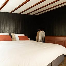 Sfeervolle slaapkamer in Vakantiehuisje in Griendtsveen, Noord Limburg, met comfortabele inrichting en warme accenten.