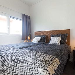 Cozy bedroom with double bed in Module 6 persons vacation home Schin op Geul, South Limburg offers peace and comfort.