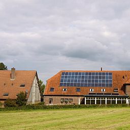 Holiday home in Epen, South Limburg, offers rustic accommodation with solar panels and sweeping views over green fields.