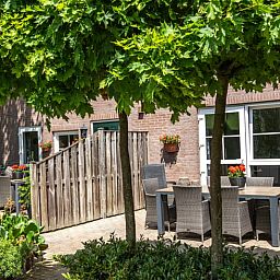 Geniessen Sie den gruenen Aussenbereich des Ferienhauses in Gulpen - Wittem, das im malerischen Suedlimburg liegt und perfekt zum Entspannen ist.