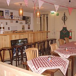 Cozy indoor area of B&B at Kaat in Liessel, De Peel, with a cozy bar and dining area.