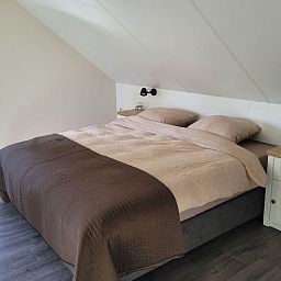 Bright dining area in Cottage in Zeeland overlooking the garden, ideal for a relaxing vacation in De Peel.