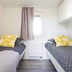 Schlafzimmer mit zwei Einzelbetten in Rialto 6 Personen Ferienhaus, Cromvoirt, Nordbrabant.