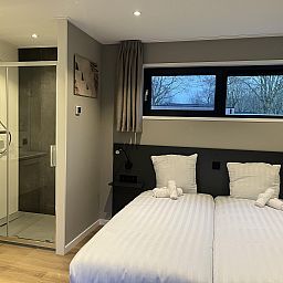 Modern bedroom in Detached house in Kaatsheuvel, Heart of Brabant, with double bed and views of nature.