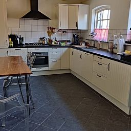 Modern kitchen in Holiday home in Best, located in the heart of Brabant, North Brabant, with stylish decor and natural light.
