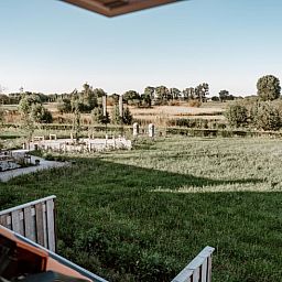 Uitzicht op groene velden vanuit Vakantiehuis in Sint-Oedenrode, Noordoost Brabant. Geniet van rust en natuur vanuit deze vakantiewoning.
