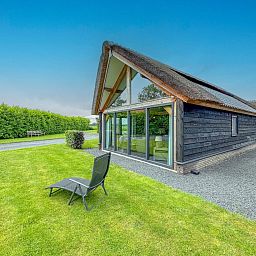 Rear view of Villa Bianco in Alphen, West Brabant with green surroundings.