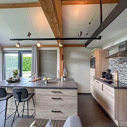 Stylish kitchen in Villa Bianco vacation home, Alphen, North Brabant.