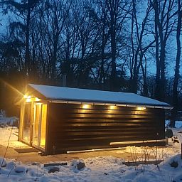 Cottage in Schijf, attractively lit vacation home in snowy West Brabant.