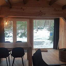 Cozy dining area in Cottage in Schijf, vacation home in West Brabant overlooking nature.