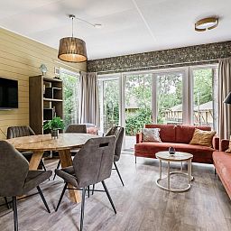 Cozy living room of Beach House sleeps 6 in Julianadorp, North Sea coast. Vacation home offers comfort and views of the nature of North Holland.