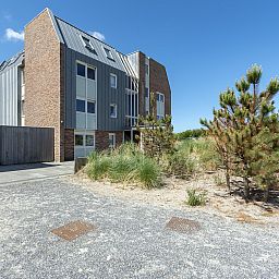 Exterior facade of Duinerei C002 Groote Keeten vacation home in Callantsoog, North Sea coast, North Holland.