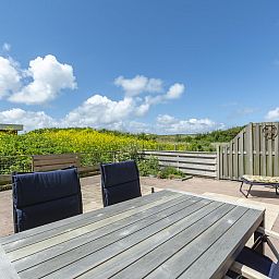 Cozy terrace with view at Duinerei C002 Groote Keeten vacation home in Callantsoog, North Sea coast, North Holland.
