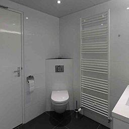 Cozy living room in vacation home NH080, Julianadorp aan Zee, overlooking the garden, North Sea coast, North Holland.