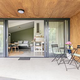 Holiday home in Noord Bakkum - Castricum offers a cozy interior with a veranda, ideal for a relaxing stay on the North Sea coast.
