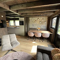 Terrace of the 6-person Dune Lodge with Charging Point in Schoorl, North Holland. Ideal place for relaxation and nature experience.
