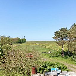 Gemuetliche Sitzecke mit Blick auf den Garten in Cottage in Schoorl, Ferienhaus in Nordholland Nord.