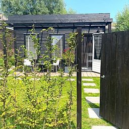 Gateway to Holiday Home in Driehuizen, surrounded by lush nature in North Holland.