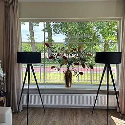 Bright interior with large windows in the cottage in Enschede, Twente.