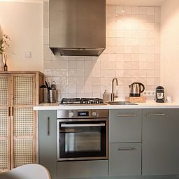 Uitzicht vanuit Vakantiehuis in Usselo, Twente, op het groene landschap en de omliggende natuur.