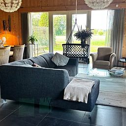 Cozy living room in vacation home in Denekamp, Twente, overlooking the garden. Comfortable vacation home in Overijssel.