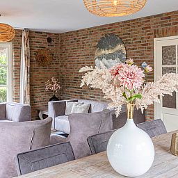 Stylish interior of Holiday Home in Losser, Twente, with comfortable seating and attractive decorations in a rural setting.