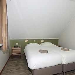 Komfortables Schlafzimmer im Ferienhaus Boshuus Comfort, Deurningen, fuer eine gute Nachtruhe.
