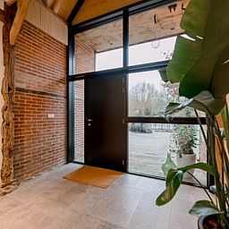 Entrance of Cottage in Agelo in Twente, Overijssel, overlooking the nature and modern interior of the cottage.