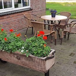 Cozy terrace at Holiday home in Lattrop Breklenkamp, ideal for outdoor dining in Twente, Overijssel.
