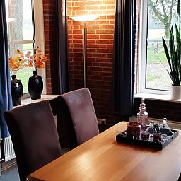 Stylish dining room in Holiday home in Lattrop Breklenkamp overlooking the greenery in Twente, Overijssel.
