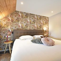 Gezellige slaapkamer in Heeresteeg vakantiehuis, Nieuwleusen, met warme inrichting, Overijssel.