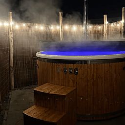 Enjoy a romantic evening in the illuminated hot tub at Holiday Home in Haarle, Overijssel.