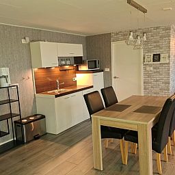 Cozy living room of Holiday home in Zwartsluis, Overijssel, with comfortable seating area and views of the serene nature.