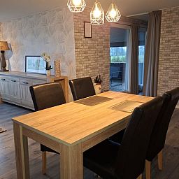 Cozy interior of Holiday home in Zwartsluis, Overijssel, with modern kitchen and dining area for a relaxing stay.