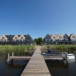 Chalet in Kampen with a wooden jetty, perfect for relaxation in Northwest Overijssel, Overijssel.