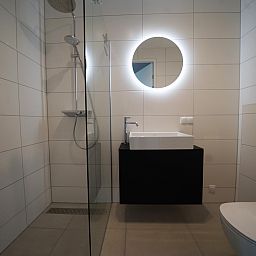 Modern bathroom in Apartment in Kampen, located in Northwest Overijssel, Overijssel, with stylish shower and sink.