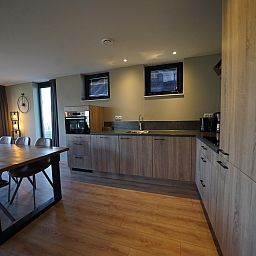 Modern kitchen and dining area in the detached house in Kampen, vacation home located in picturesque Northwest Overijssel, Overijssel.