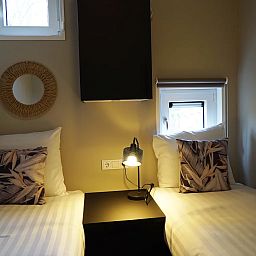 Cozy bedroom in detached house in IJhorst, Overijssel, with comfortable beds and mood lighting.