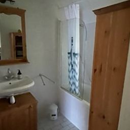 Stylish bathroom of Holiday Home in IJhorst with spacious shower and wooden accents.