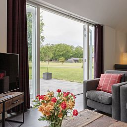 Discover the green surroundings of vacation home OV473 in Baars, Overijssel, surrounded by lush nature and serene forest landscapes.