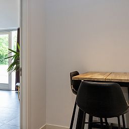 Cozy indoor area of vacation home OV473 in Baars, Overijssel, with a cozy sitting area and views of green nature.