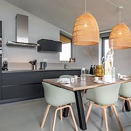Dining area in Holiday home in Wissenkerke, Noord-Beveland, Zeeland with modern furnishings.